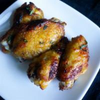 Ponzu Glazed Wings · Crispy and flavorful classic chicken wings with Buffalo flavor packed sauce.