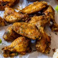 Garlic Parmesan Wings · Crispy and flavorful classic chicken wings with Buffalo flavor packed sauce.