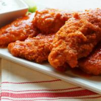 Buffalo Chicken Tenders · Crispy and flavorful classic chicken wings with Buffalo flavor packed sauce.