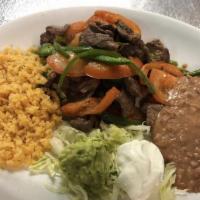 Bistec a la Mexican Plate · Steak sauteed with onions, tomatoes and jalapenos.