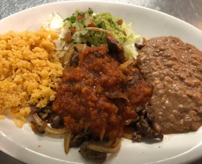 Bistec Rancheo Plate · Grilled steak topped with ranchero sauce and grilled onions.