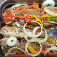 Red Snapper · Escovitch red snapper, fish is fried and then we add a vinegar sauce with bell pepper, carro...