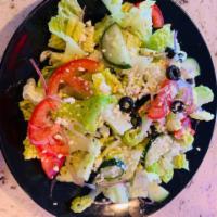 Mediterranean Salad  · Romaine lettuce, tomatoes, cucumbers, onions, olives  with our in-house dressing.  