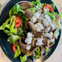 Gyro Salad  · Romaine lettuce, tommatoes, onions, cucumbers, olives and pickles tossed in our in-house dre...