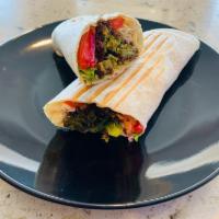 Falafel wrap · Five flafel pieces tomatoes , lettuce, and onions served with choices of sauce 
tahini sauce...