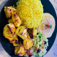  Skewers chicken plate ·  Skewers of chicken  served with rice, bread and salad.  