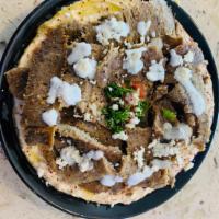  Hummus and Meat Plate · Chicken shawrma or lamb and beef Gyro over Hummus and topped with a choice of tahini, taziki...