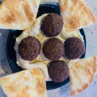 falafel over hummus plate ·  5 deep fried balls over hummus plate served with pita bread