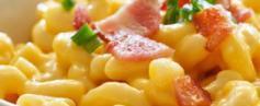 Loaded Mac & Cheese · Served with bacon bits, green onions, and a dash paprika.