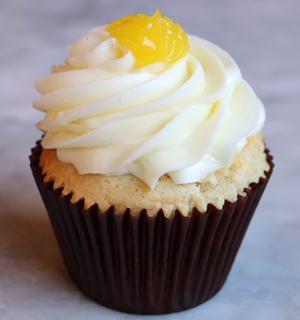 Lemon Drop Cake · Our vanilla bean cake filled with a tart lemon filling and iced with lemon buttercream.