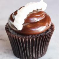 Chocolate Cream Cupcake · Chocolate cupcake filled with vanilla buttercream topped with fudge and dollops of vanilla b...