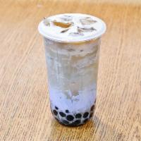 Taro Milk Tea · Premium black tea, fresh taro coated on the sides of the cup, taro mixture and non-dairy cre...