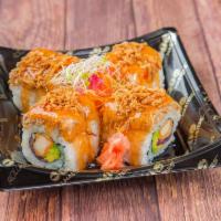 Kung Fu Roll · kani tempura, onion tempura, avocado topped w salmon salad, sweet chili galze, crispy onions