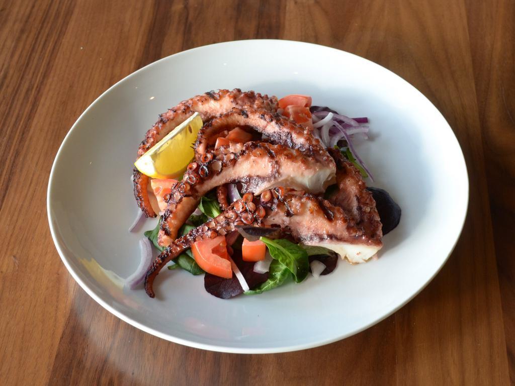 Grilled Octopus · Tender baby Spanish octopus tossed with extra virgin olive oil. Gluten free.