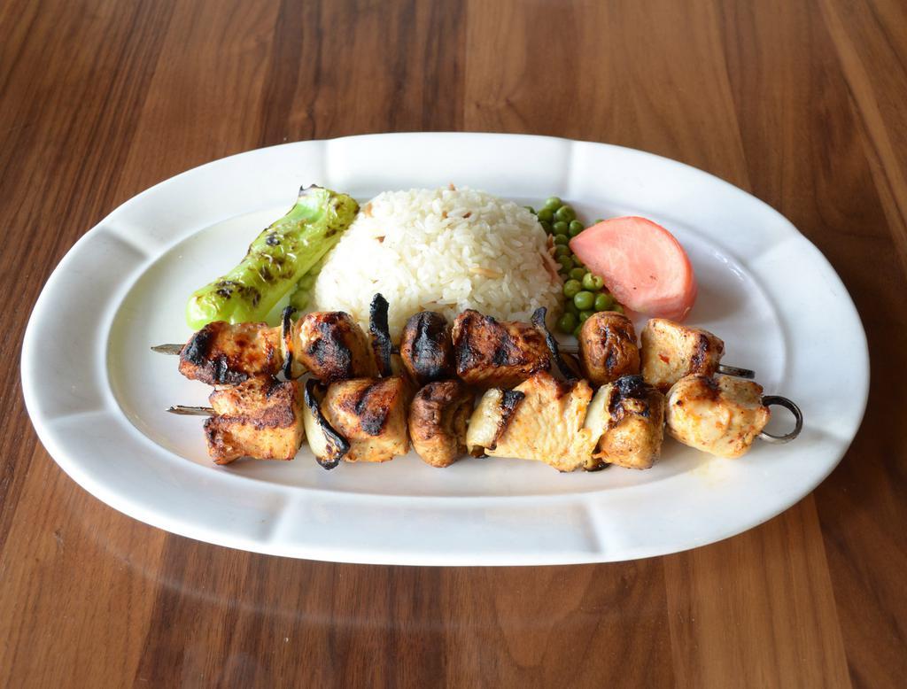 Chicken Kebab · Tender cubes of chicken, mushrooms and onions marinated with chef's special herbs and spices.