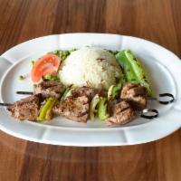 Lamb Kebab · Marinated lean cubes of lamb on a skewer with peppers and onions.