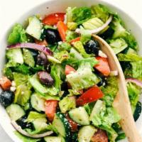 Greek Salad · Lettuce, onion, tomato with feta cheese, and black olives.