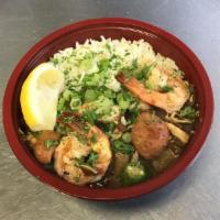 The Trinity · Our signature Gumbo sauce loaded with Shrimp, Andouille, Chicken, and Okra. My personal favo...