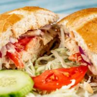 Chimi Sandwich · Dominican style beef sandwich. Seasoned beef burger with pickled cabbage, tomatoes and red o...