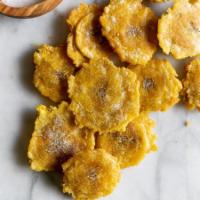 Tostones  · Fried green plantain.