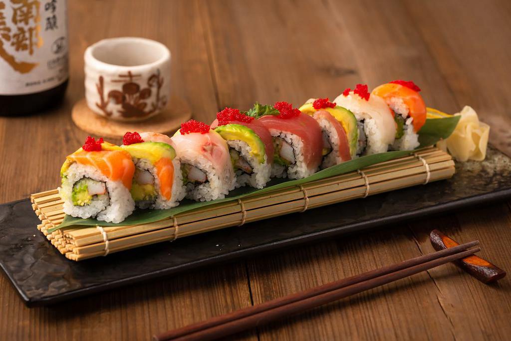 Rainbow Roll · Kani, cucumber and avocado top with tuna, salmon, white fish, shrimp, avocado and red tobiko.