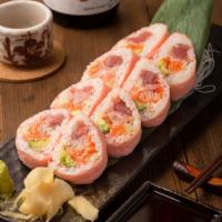 Pink Lady Roll · Tuna, salmon, white fish, avocado, crunch wrapped with soy bean sheet.