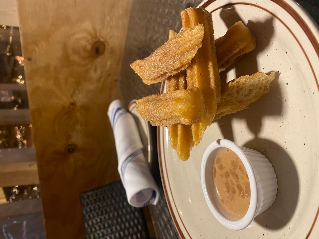Churros · Churros tossed in cinnamon and sugar served with chocolate sauce