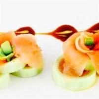 Naruto Sashimi · Tuna, salmon, fish and crabmeat wrapped in cucumber and served with plum mayo.