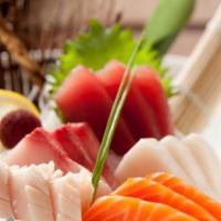 Sashimi Deluxe · Sixteen pieces of assorted fish. Served with a side. 