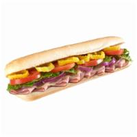 Ham and Cheese Sub · Ham, provolone cheese, hot pepper rings, red onions, lettuce, tomatoes and mustard sauce. 