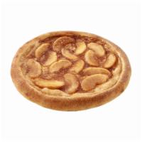 Apple Pie-zza · Oven-baked, featuring a cheesecake filling base and topped with delectable cinnamon apples.