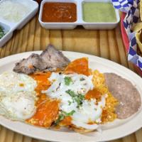 Carne Asada con Chilaquiles y 2 Huevos · Steak with 2 eggs cooked any way you want. Served with fried seasoned tortillas with sauce.