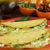 Special 2 Big Corn Quesadillas  · Big corn quesadilla. A handmade corn tortilla with your choice of meat. Filled with lettuce ...