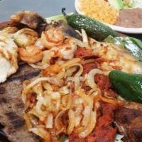 Super Parrillada · Pork ribs, steak, chicken breast, shrimp, carnitas, Mexican sausage (chorizo), 2 different o...