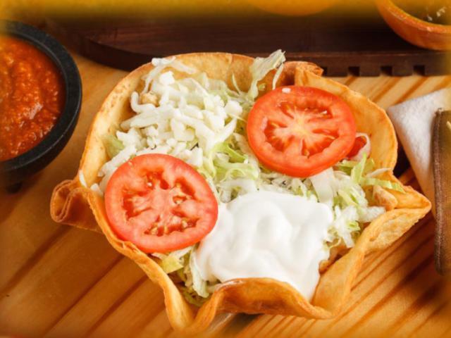 Taco Salad · Choice of meat, Rice, beans, lettuce, pico de gallo, 
 sour cream, mozarella cheese.