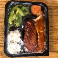 Roast Pork and Soy Sauce Chicken on Rice （叉烧豉油鸡饭） · BBQ Cha siu with braised soy sauce chicken over rice.
