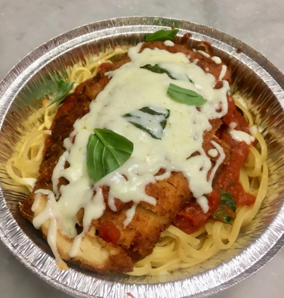 Chicken Parmigiana · Served with chicken cutlet,linguini pasta,marinara sauce ,italian bread and parmasan cheese on the side.
