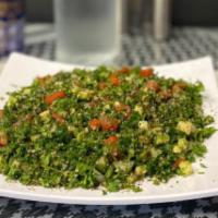 Taboole Salad · Parsley and tomato salad.  Vegetarian.