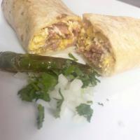 Breakfast Burrito · Scrambled egg burrito with your choice of ham, bacon, and chorizo.