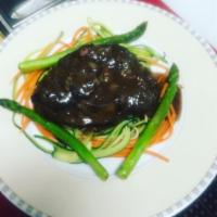 Steak au Poivre · NY strip loin in a spicy brown peppercorn sauce.