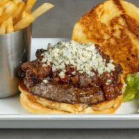 The Blues Burger · Our famous patty topped with crumbled blue cheese and tasty bacon jam on a fresh brioche roll.