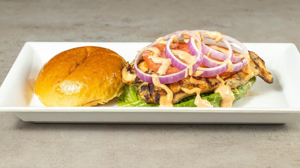 Grilled Chicken Sandwich · Freshly grilled boneless chicken breast served with a southwestern aioli, lettuce, tomato and onion on 1 of our fresh rolls.