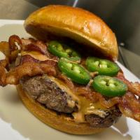 Jalapeno, Bacon and Peanut Butter Burger · Come try our brand new burgers complete with fresh Jalapenos, Bacon and a peanut butter driz...