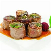 Beef Negimaki · Broiled rolled beef with scallion in teriyaki sauce. 