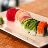 Rainbow Roll · Kani (crab meat), cucumber, avocado inside the roll, topped with tuna, yellow tail and salmo...