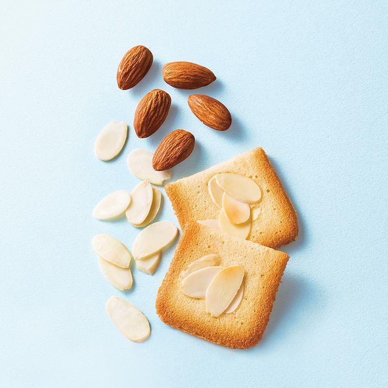 Yoku Moku Billet Aux Amandes · Delicate, butter-vanilla cookies dusted with slivered almonds.  24 cookies in a tin. 