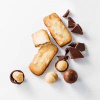 Yoku Moku Bateau de Macadamia (16 pc) · Buttery shortbread cookies generously topped with macadamia nuts and milk chocolate inside. ...