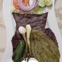 Cecina Asada · Nopales, cebollin y jalapeno. Grilled aged beef with cactus, chives, and jalapeno.