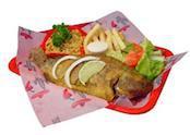 Mojarra Frita · A whole fish (tilapia) served with french fries and salad and rice.