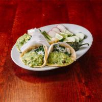 9. Oreja Taco · Pork ear. Served with cilantro, onions and guacamole.